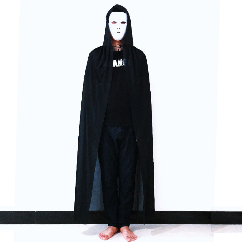Person wearing a black hooded cloak and white mask on a white background