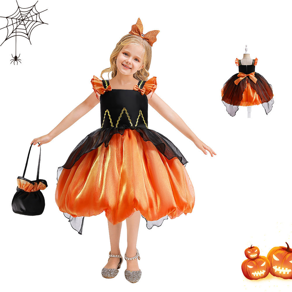 Child wearing an orange and black Halloween costume with a pumpkin design, holding a black bag.