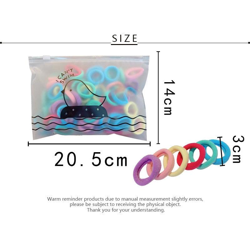 Packaging of colorful hair ties with dimensions and size label.