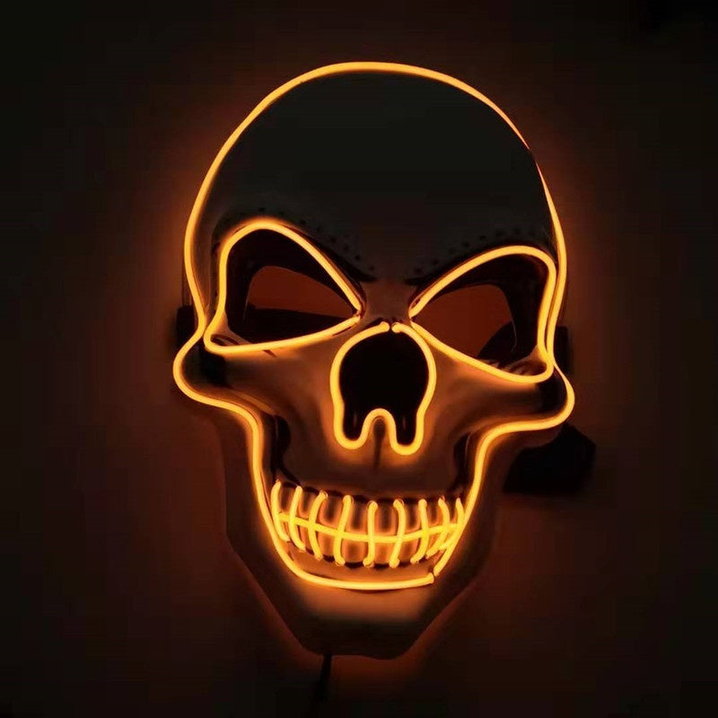 Skull mask with glowing orange outline on a dark background