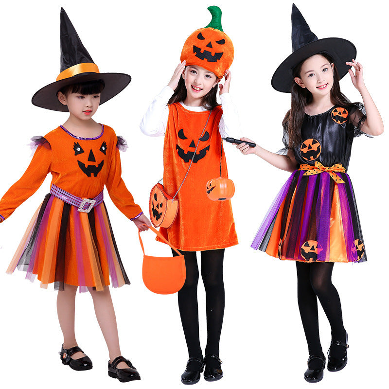 Three children in Halloween costumes with pumpkins and witch hats on a white background