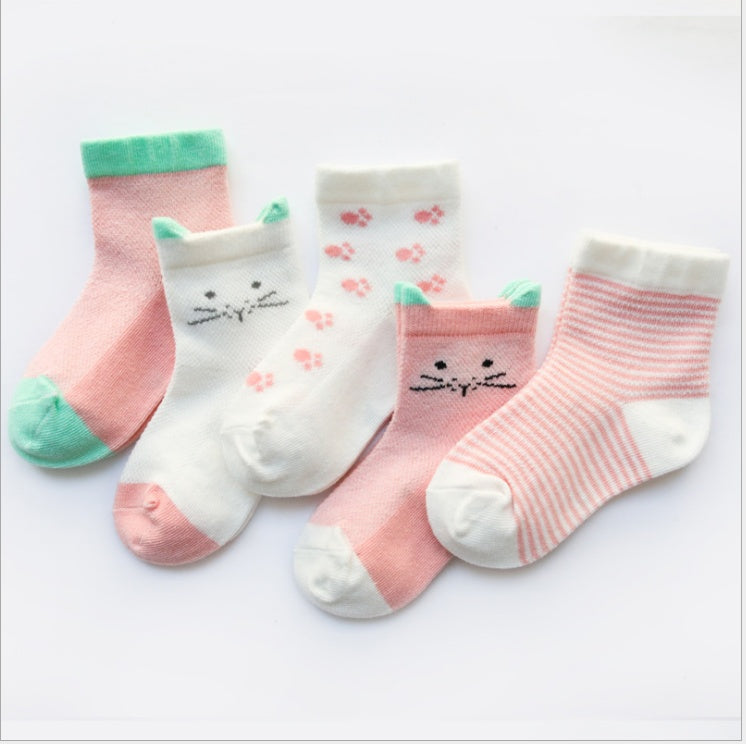 Set of four baby socks with cat face design on a white background