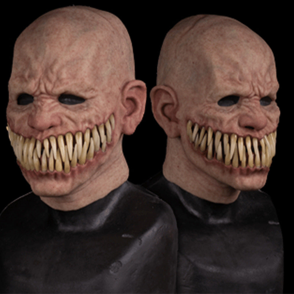 Two identical masks with a恐怖 design on a black background