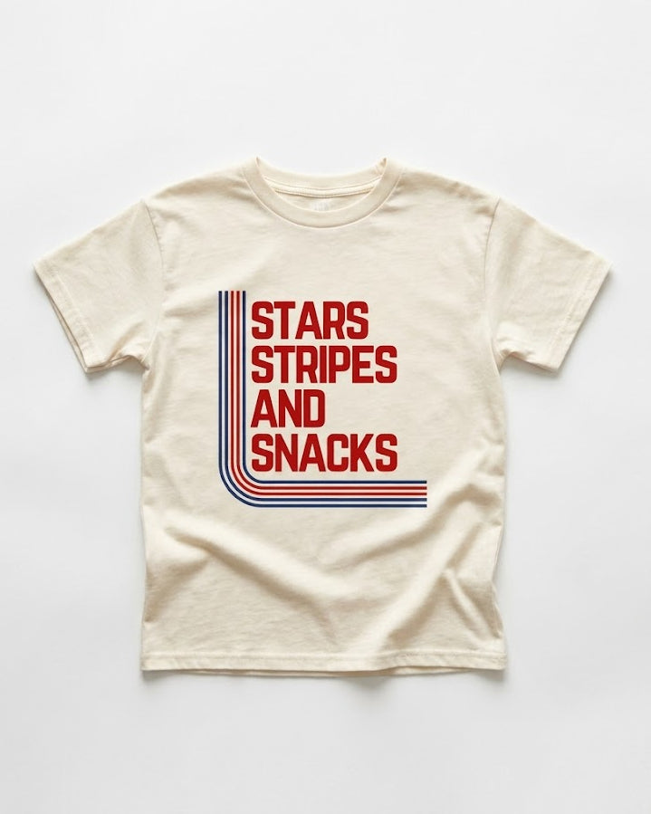 Beige t-shirt with 'Stars Stripes and Snacks' text design on a white background