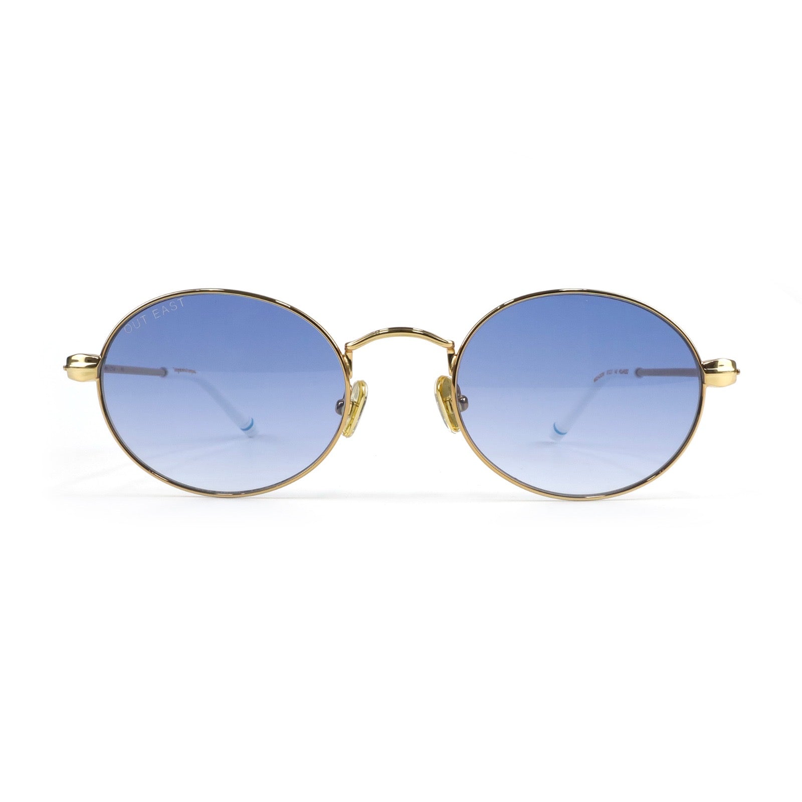 Round sunglasses with gold frame and blue gradient lenses on a white background