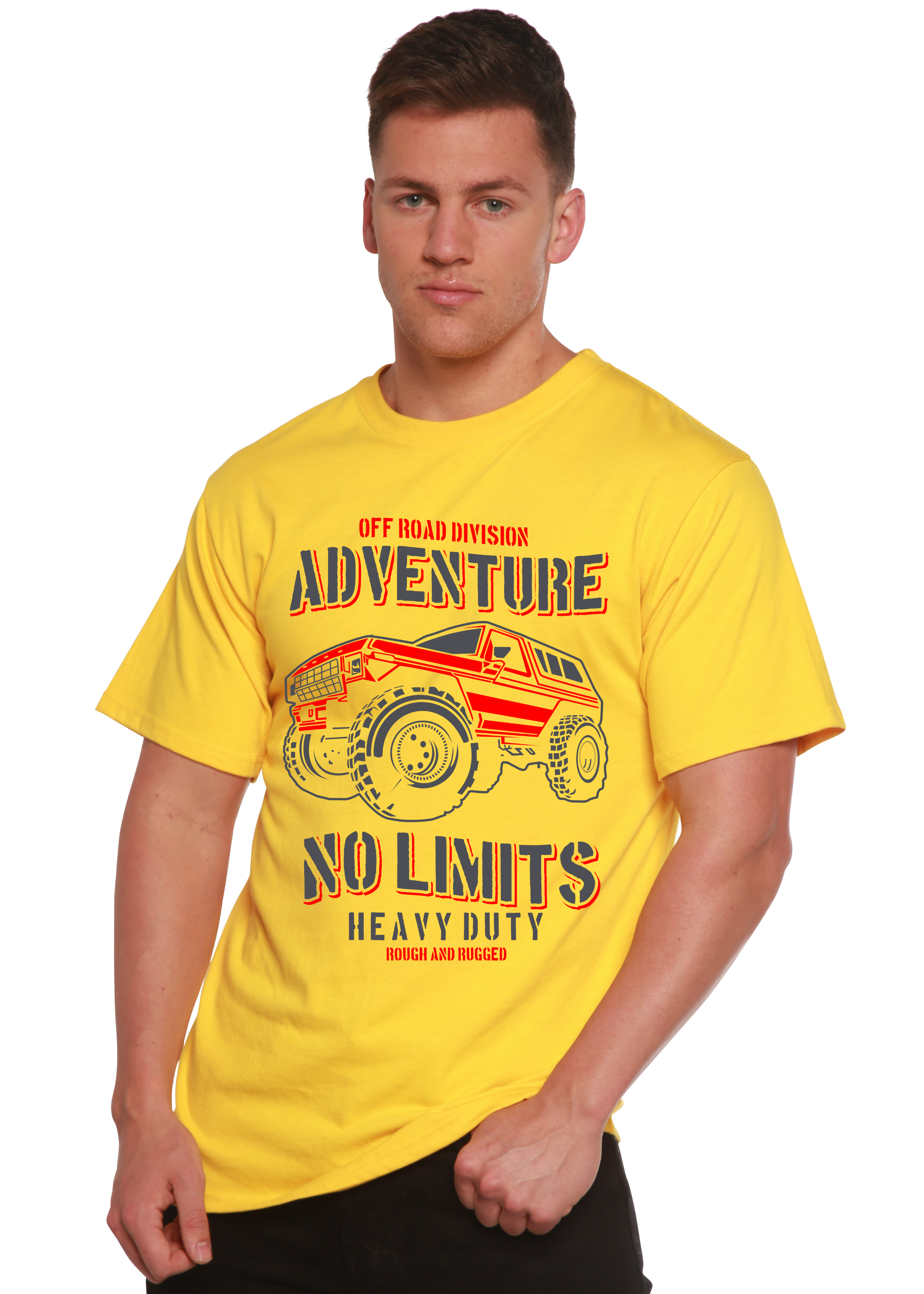Man wearing a yellow t-shirt with off-road vehicle graphic and text