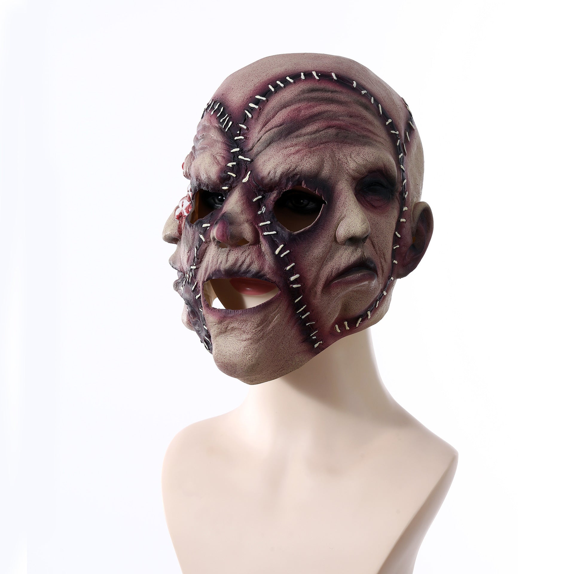 Horror-themed mask on a mannequin head against a white background