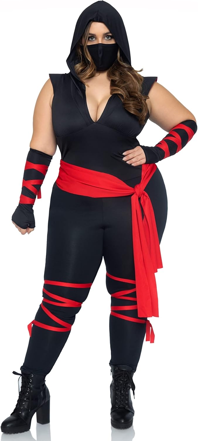 Person wearing a black and red ninja costume with a hood and arm bands.