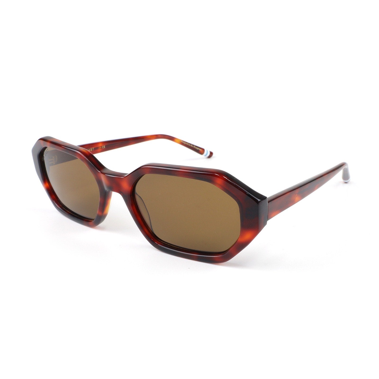 Sunglasses with tortoiseshell frame and brown lenses on a white background