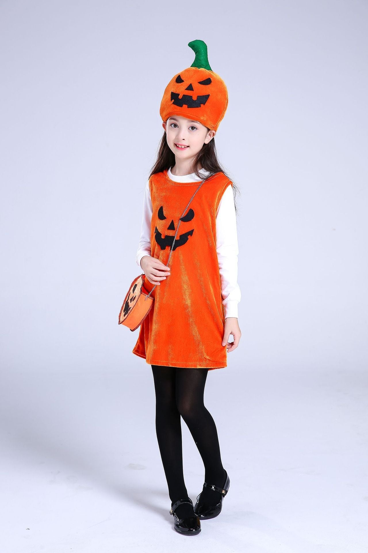 Child wearing an orange Halloween costume with a pumpkin design on a white background