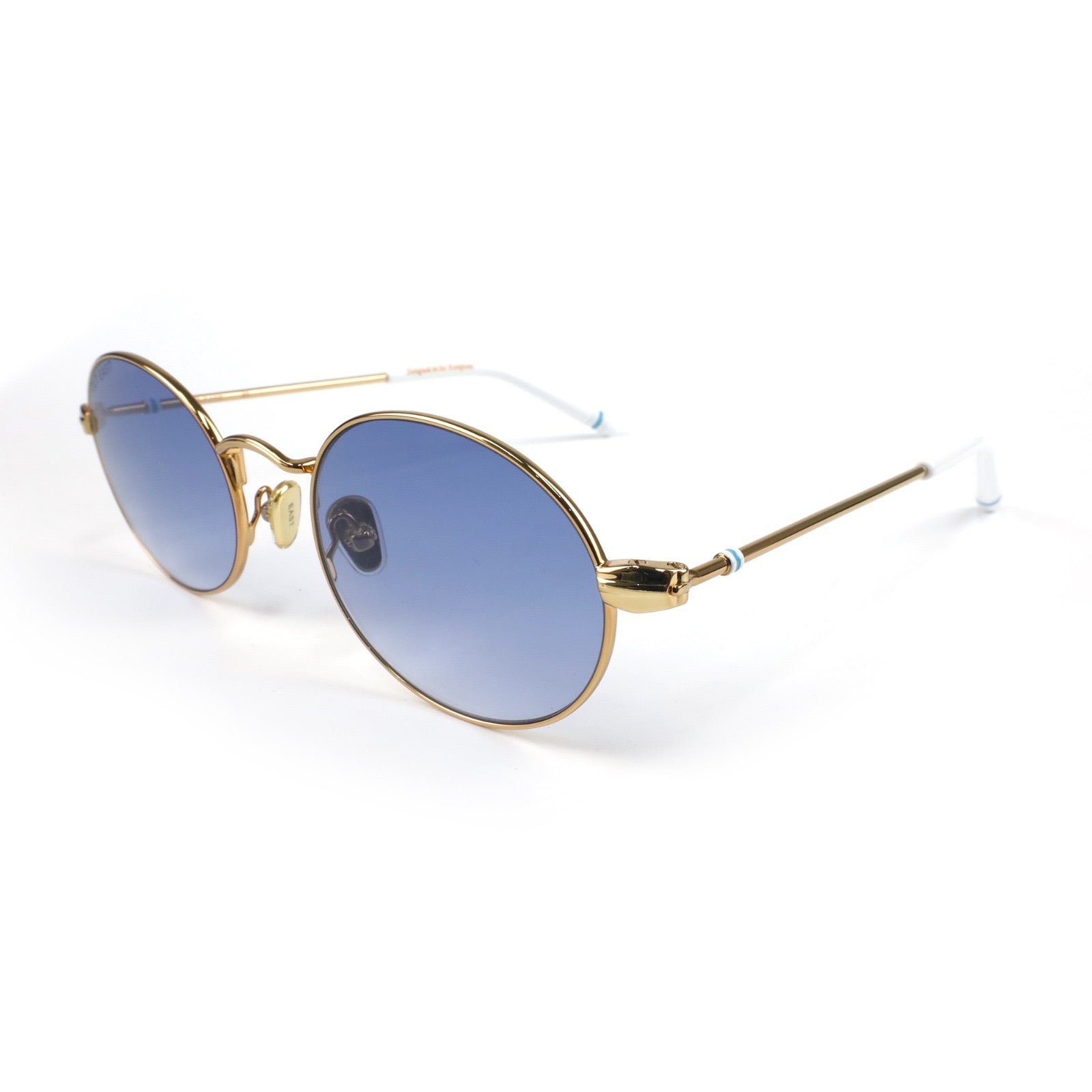 Gold-framed sunglasses with blue gradient lenses on a white background