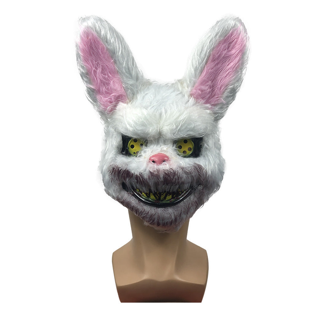 White rabbit mask with pink inner ears on a mannequin head against a white background