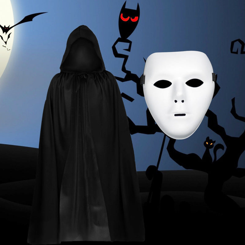 Person in black hooded cloak with white mask against a Halloween-themed background