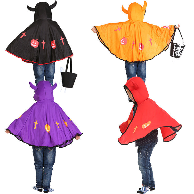 Four colorful ponchos in black, orange, purple, and red with decorative elements on a white background.