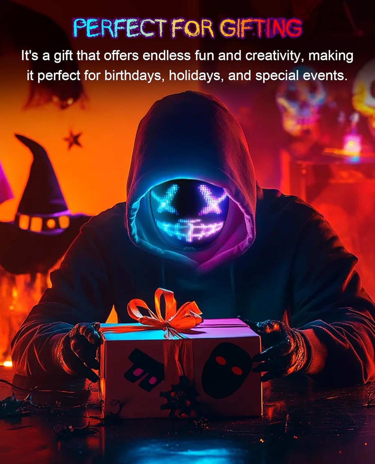 Person wearing a glowing mask holding a gift with Halloween-themed decorations in the background.