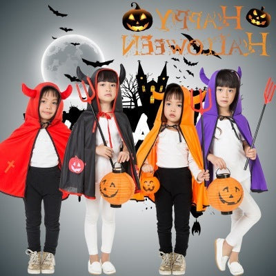 Four children in Halloween costumes with props against a dark background with Halloween-themed decorations.