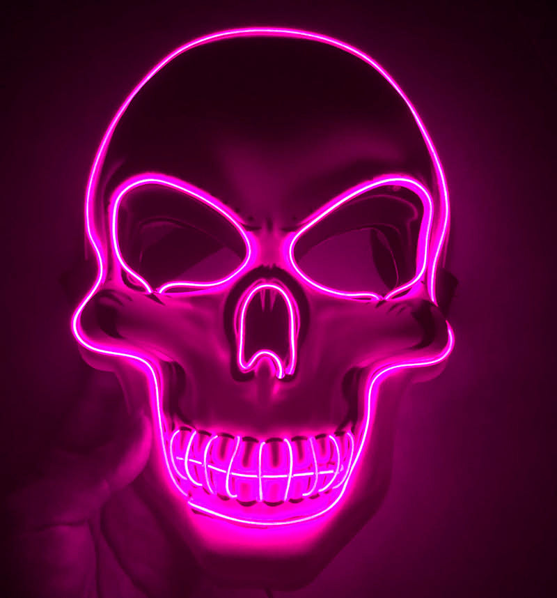 Neon pink skull mask on a dark background