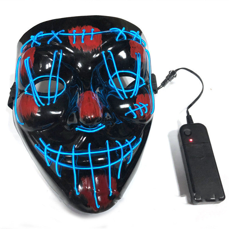 Black mask with blue LED lights and a remote control on a white background