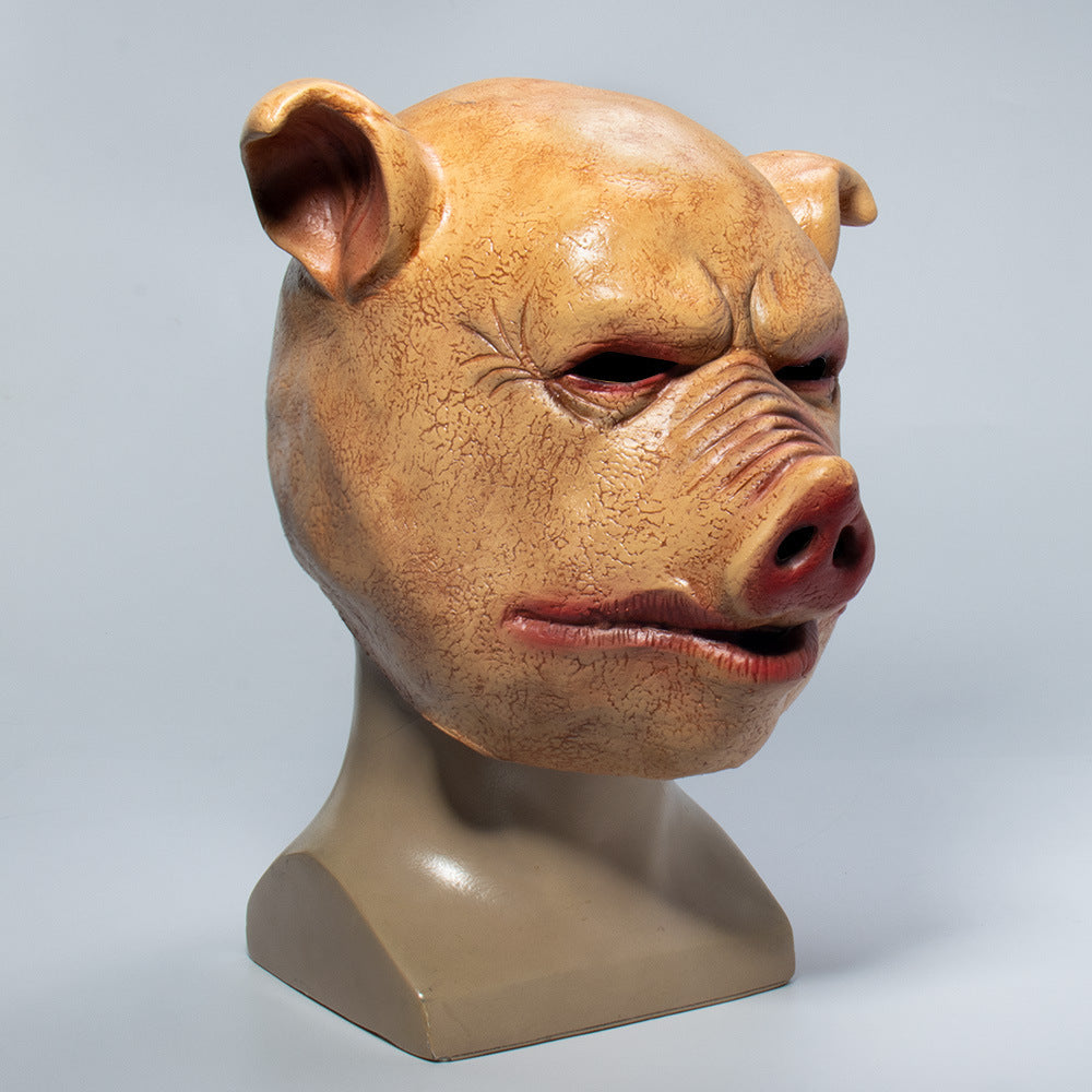 Pig mask on a mannequin head against a gray background