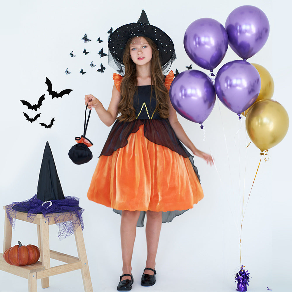Child in Halloween witch costume with purple and gold balloons on a white background