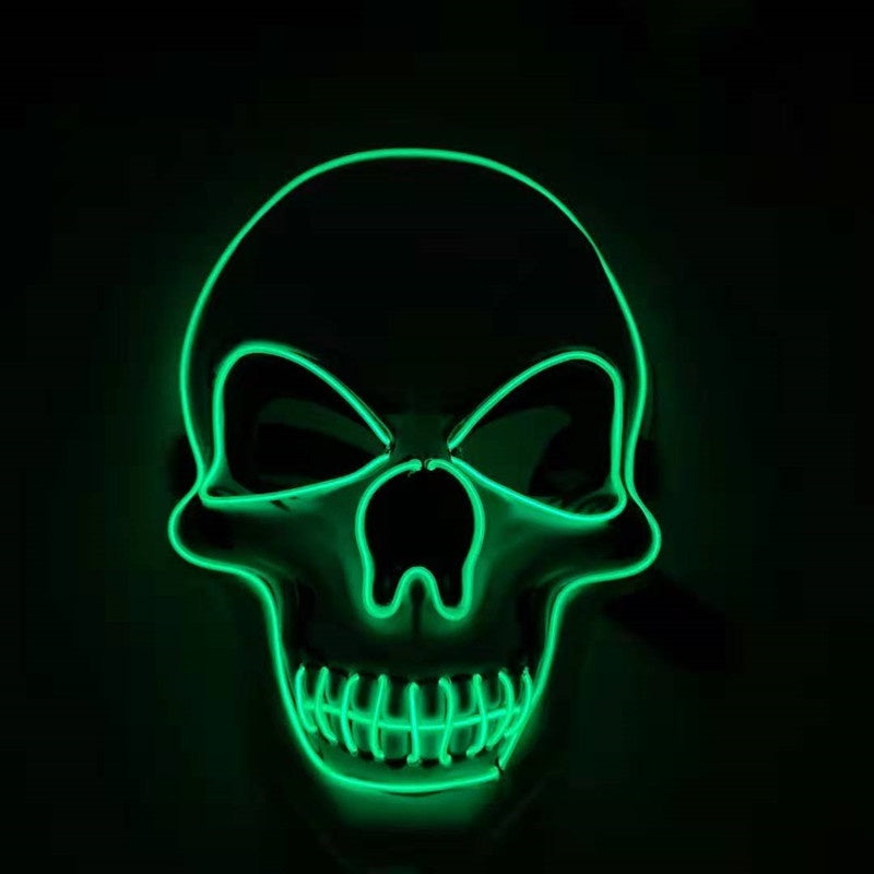 Green LED skull mask on a black background