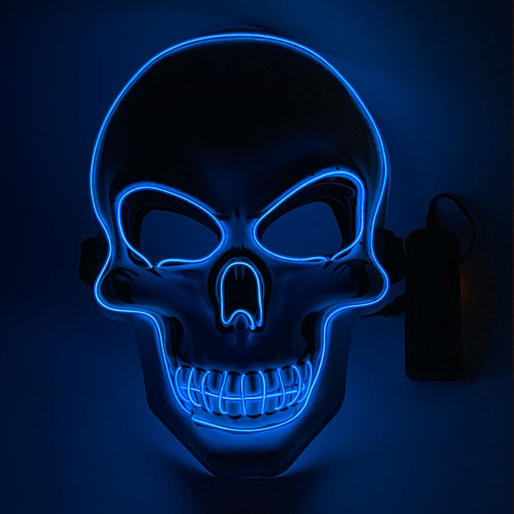 Neon blue skull mask on a dark background