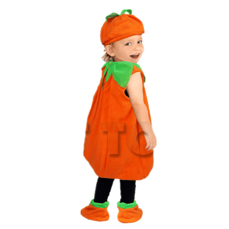 Child wearing a pumpkin costume with a white background