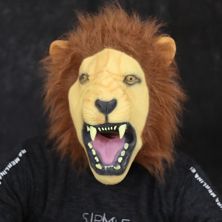 Person wearing a lion mask with an open mouth on a dark background
