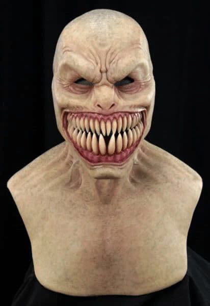 Creepy mask with exaggerated features on a black background