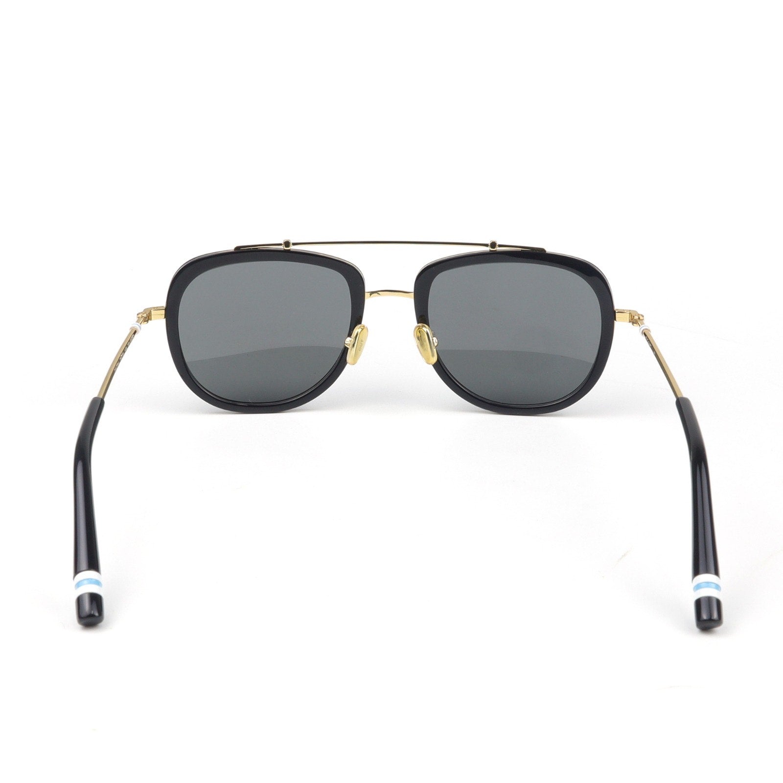 Sunglasses with black frames and black arms on a white background