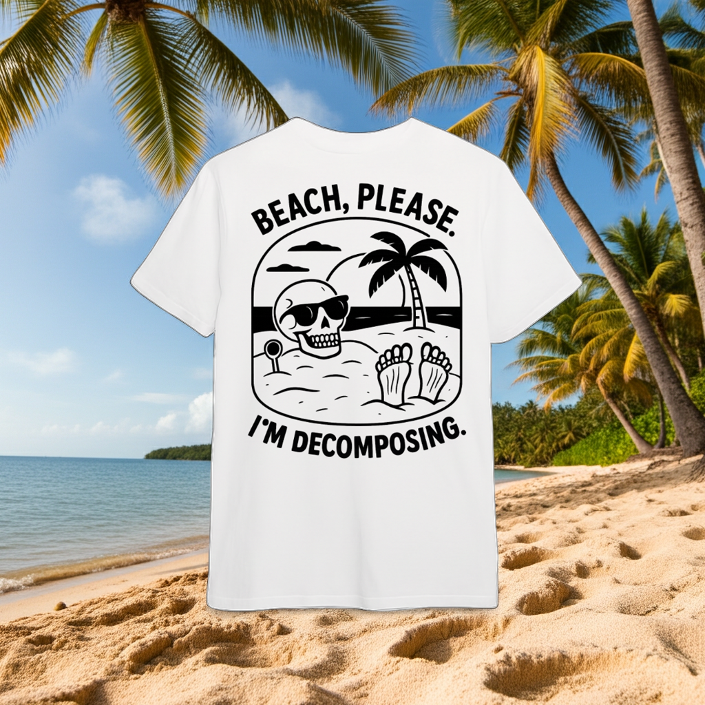 White t-shirt with black graphic and text 'Beach, please. I'm Decomposing.' with a beach background with palm trees