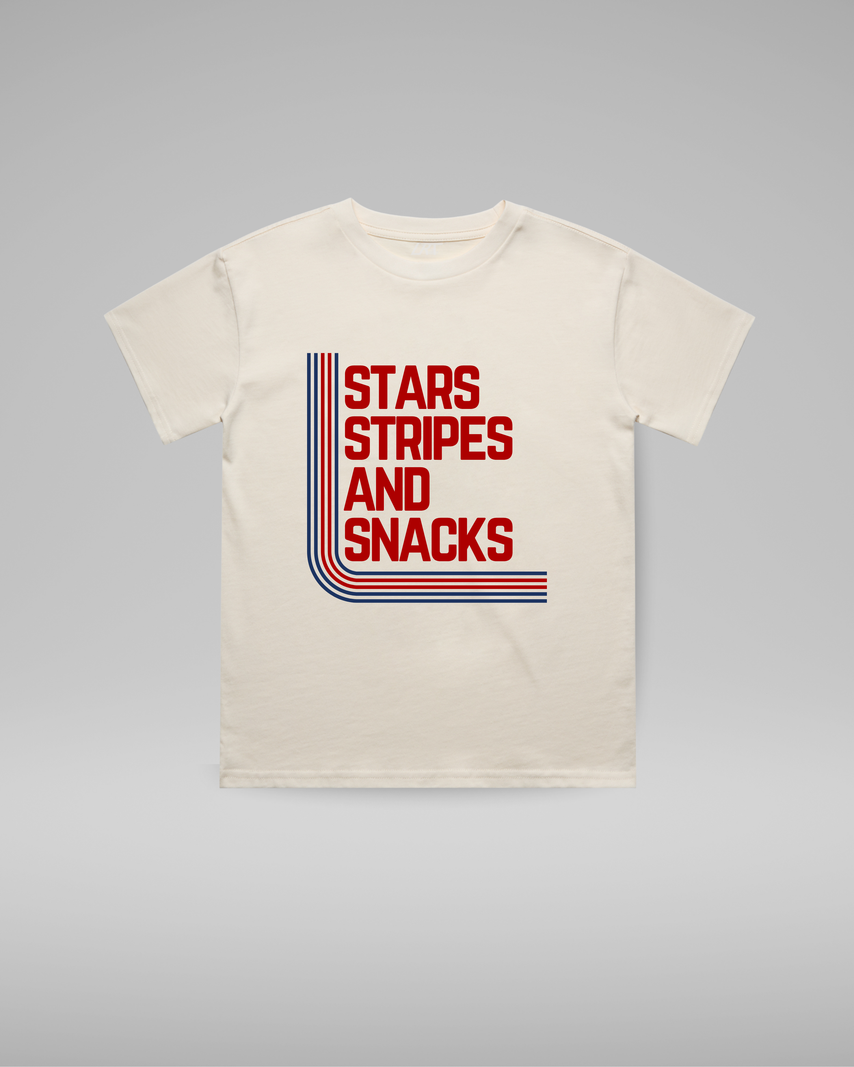Beige t-shirt with 'Stars Stripes and Snacks' text design on a gray background