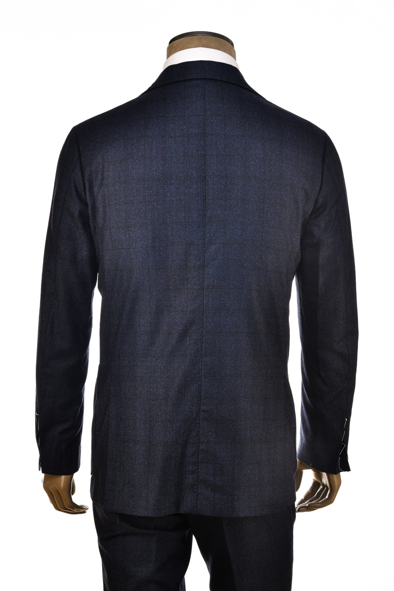 Dark blue suit jacket on a mannequin against a white background