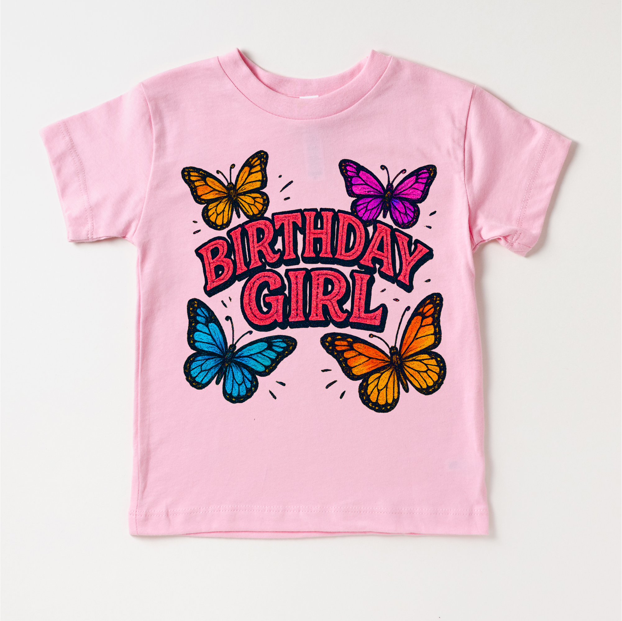 Pink t-shirt with 'Birthday Girl' text and colorful butterflies on a white background