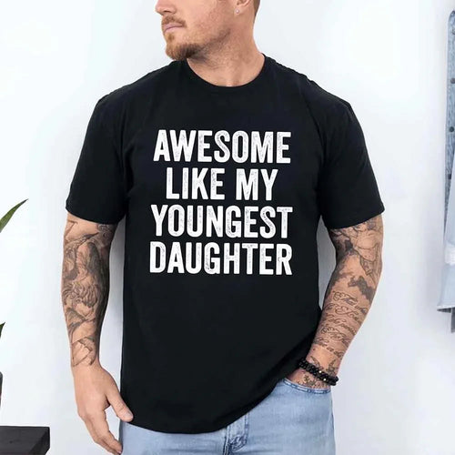 Man wearing a black t-shirt with 'Awesome like my youngest daughter' text.