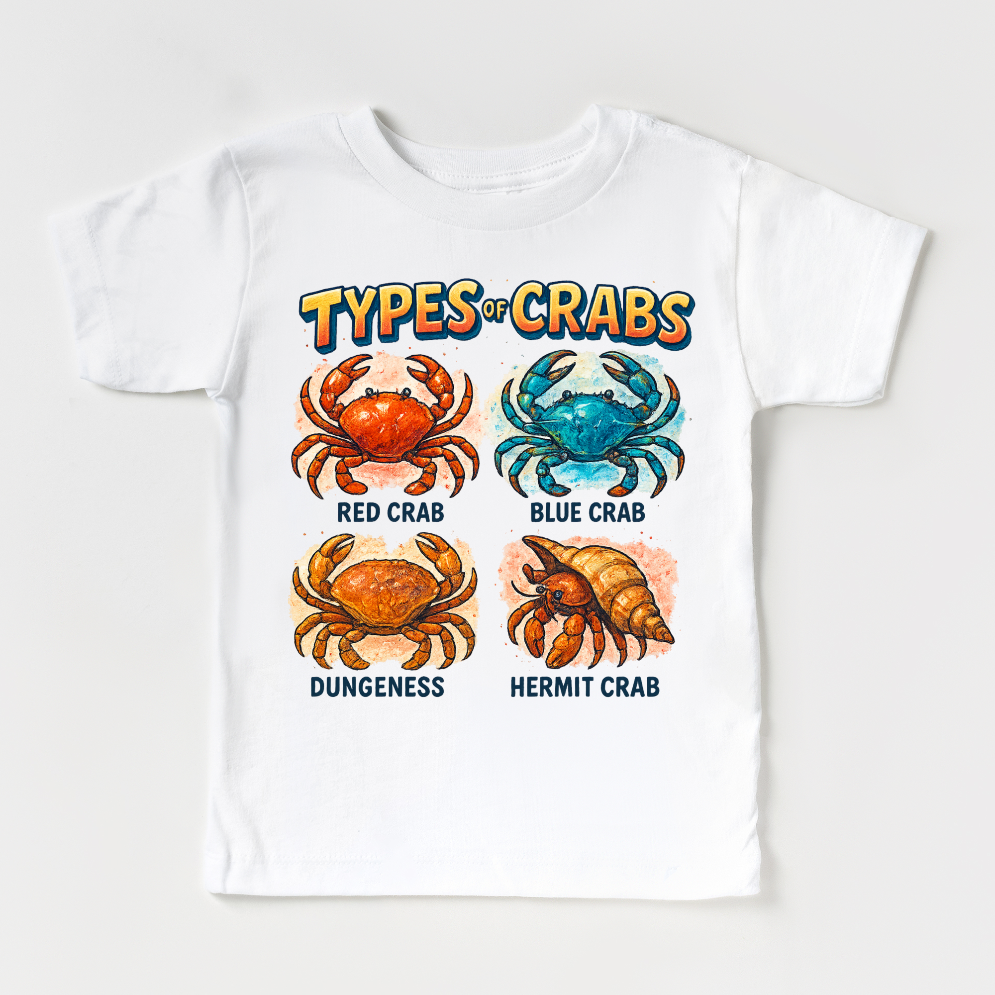White t-shirt with illustrations of different types of crabs and their names on a white background.
