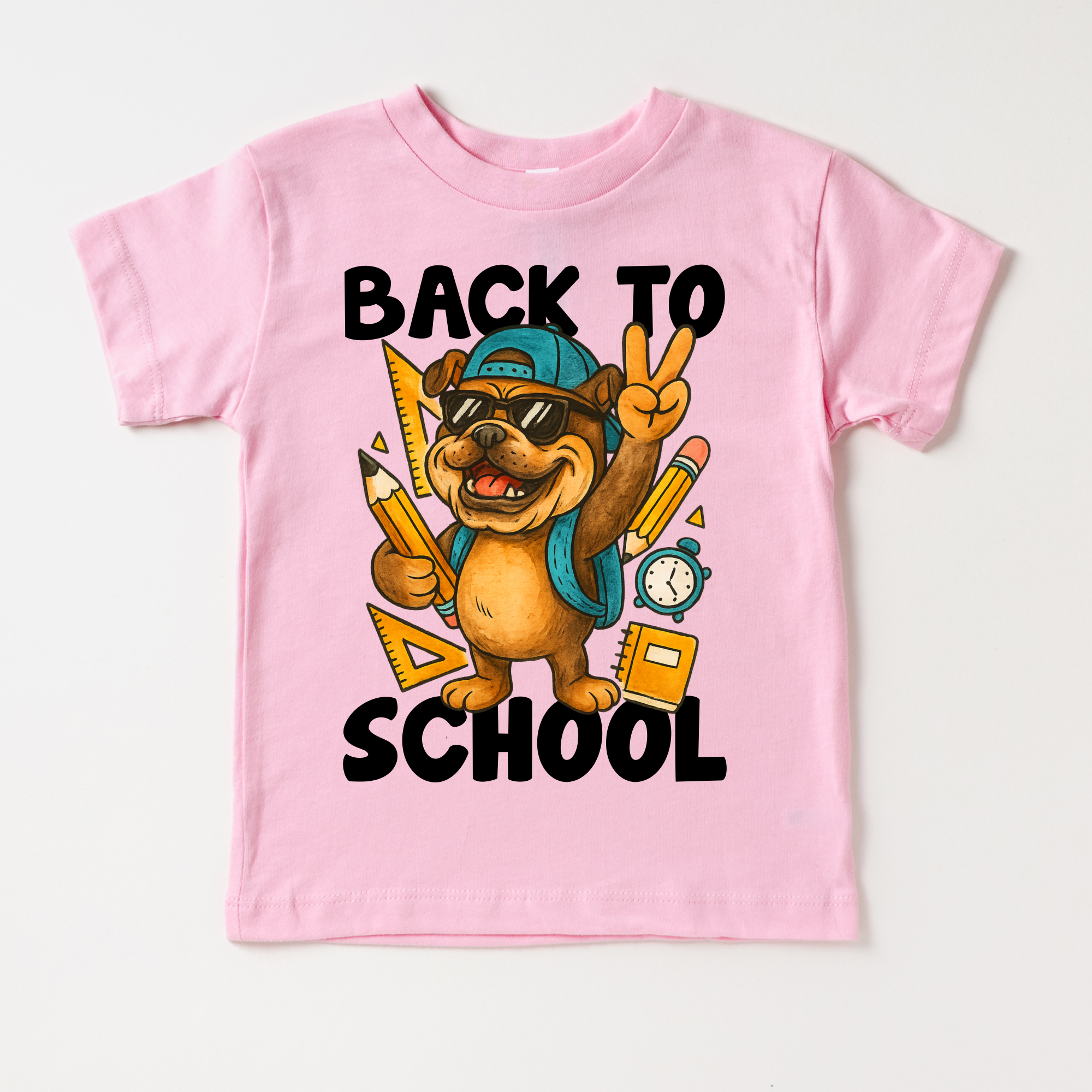 Pink t-shirt with a bear graphic and 'Back to School' text on a white background
