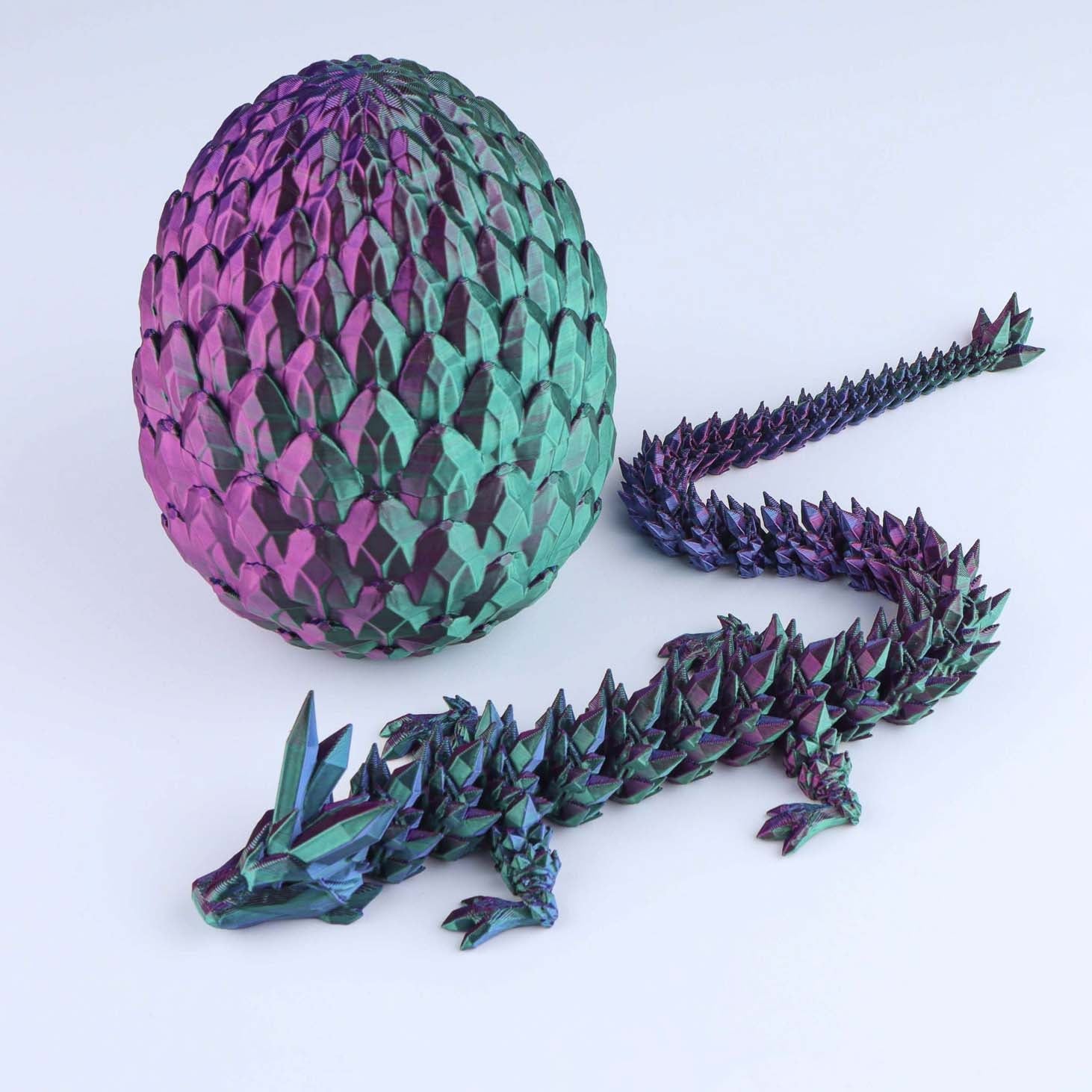 Colorful dragon egg and dragon model on a white background