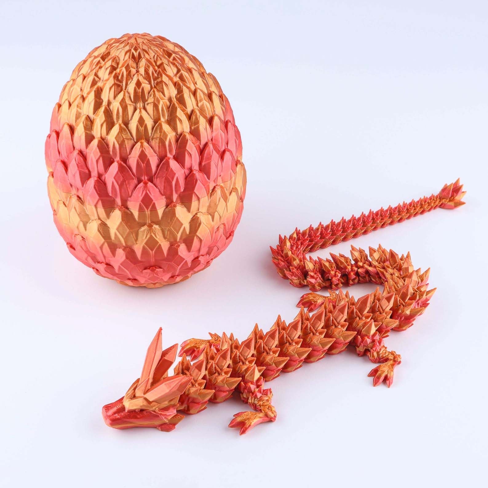 Origami dragon and egg on a white background