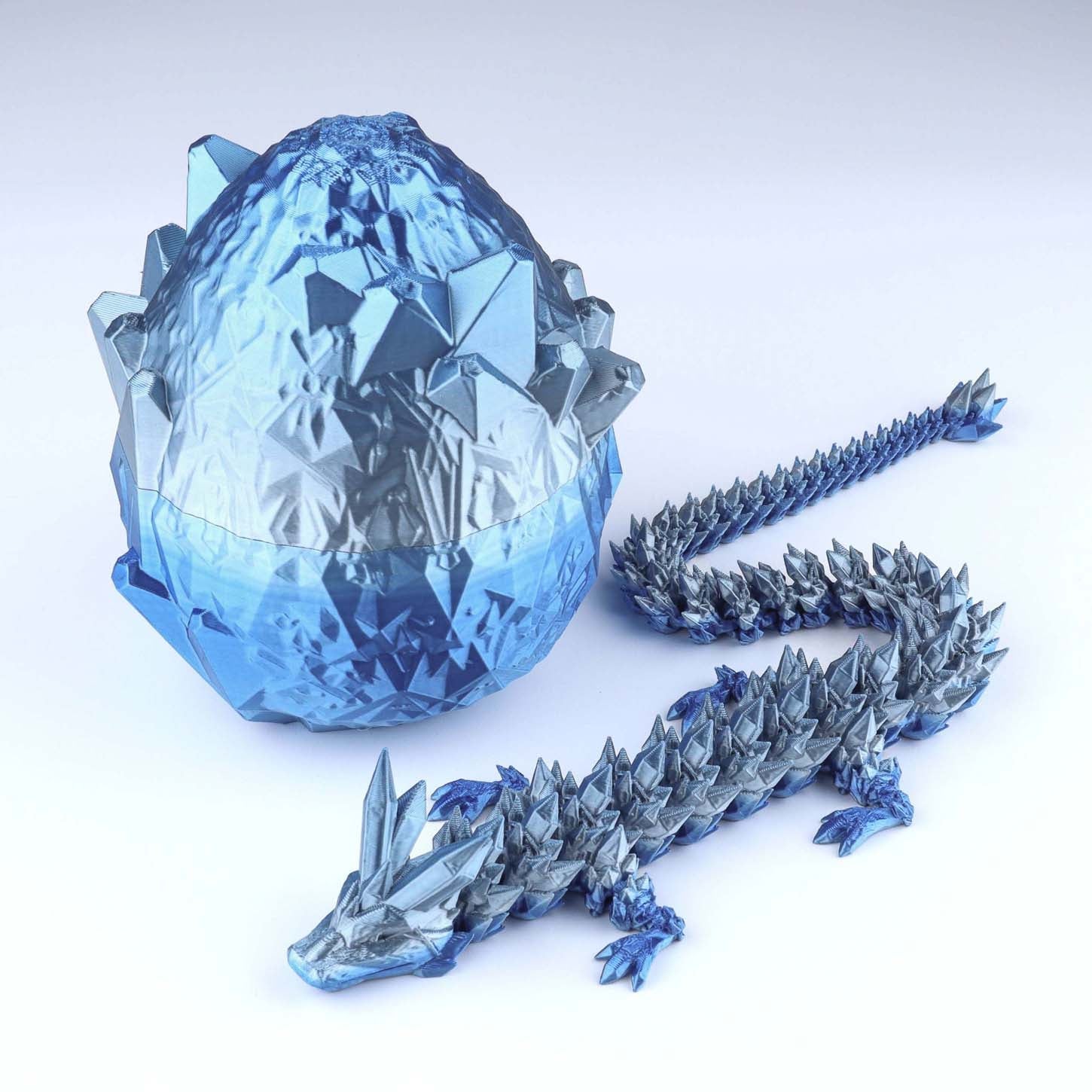 Blue crystal dragon egg and dragon on a white background