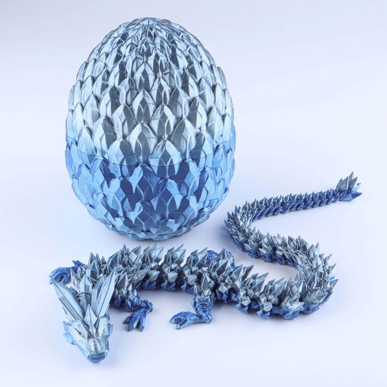 Blue crystal dragon egg and dragon on a white background