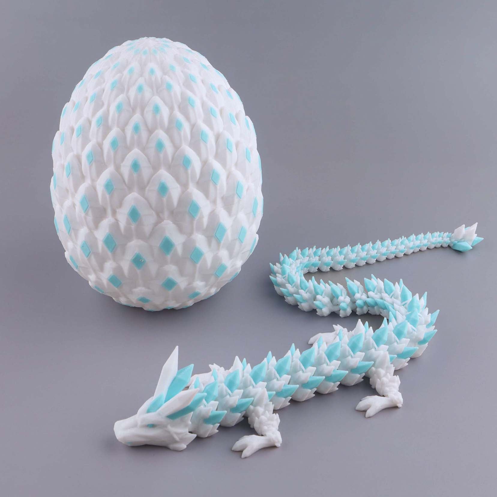 White and blue dragon egg with a dragon model on a gray background