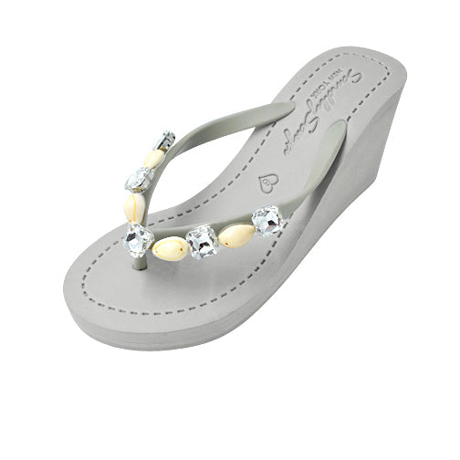 Gray sandal with crystal embellishments on a white background