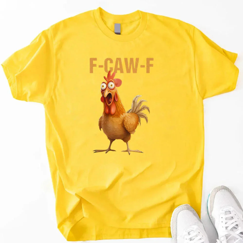 Yellow t-shirt with a cartoon rooster and 'F-CAW-F' text, paired with white sneakers on a white background.