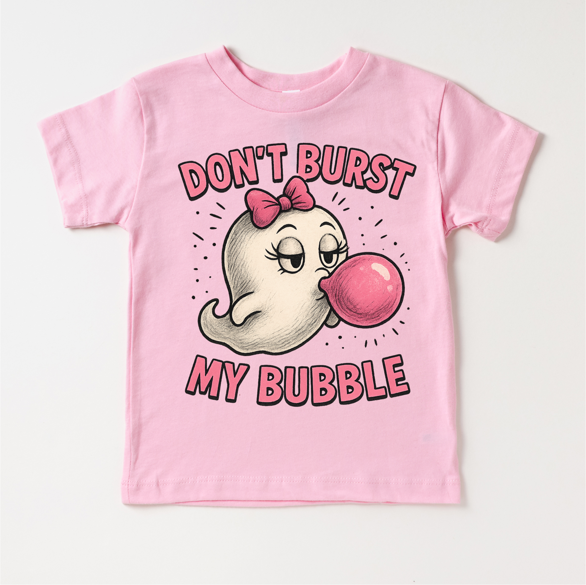 Pink t-shirt with cartoon character and text 'Don't Burst My Bubble' on a white background