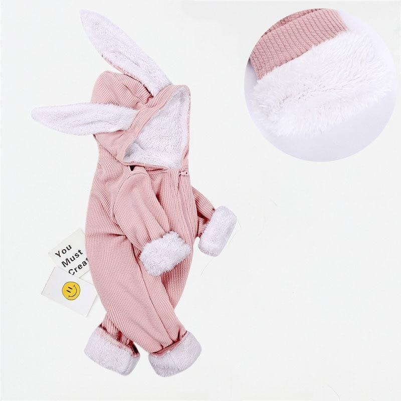 Pink bunny costume with white accents on a light gray background