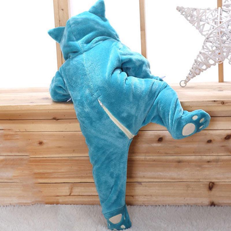 Blue cat-themed onesie on a wooden surface