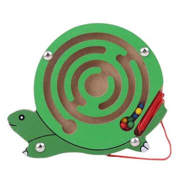 Turtle-shaped maze toy with a string and colored beads on a white background