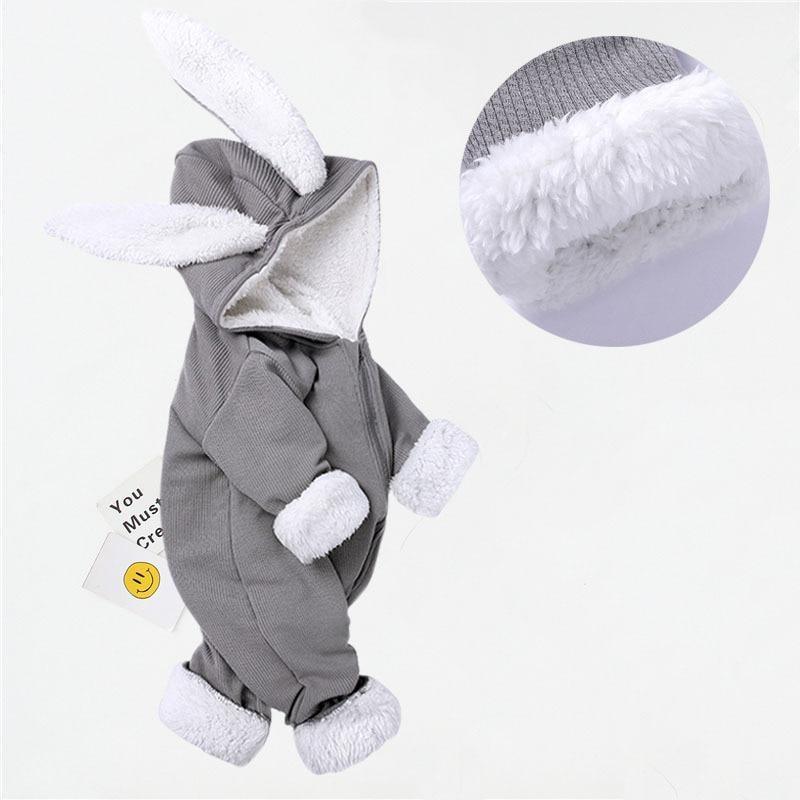 Gray baby onesie with bunny ears and feet on a white background