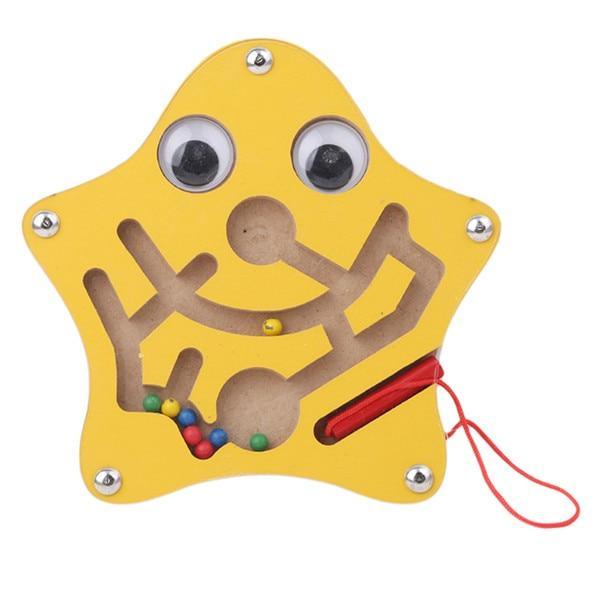 Yellow star-shaped toy with googly eyes, a red string, and colorful beads on a white background